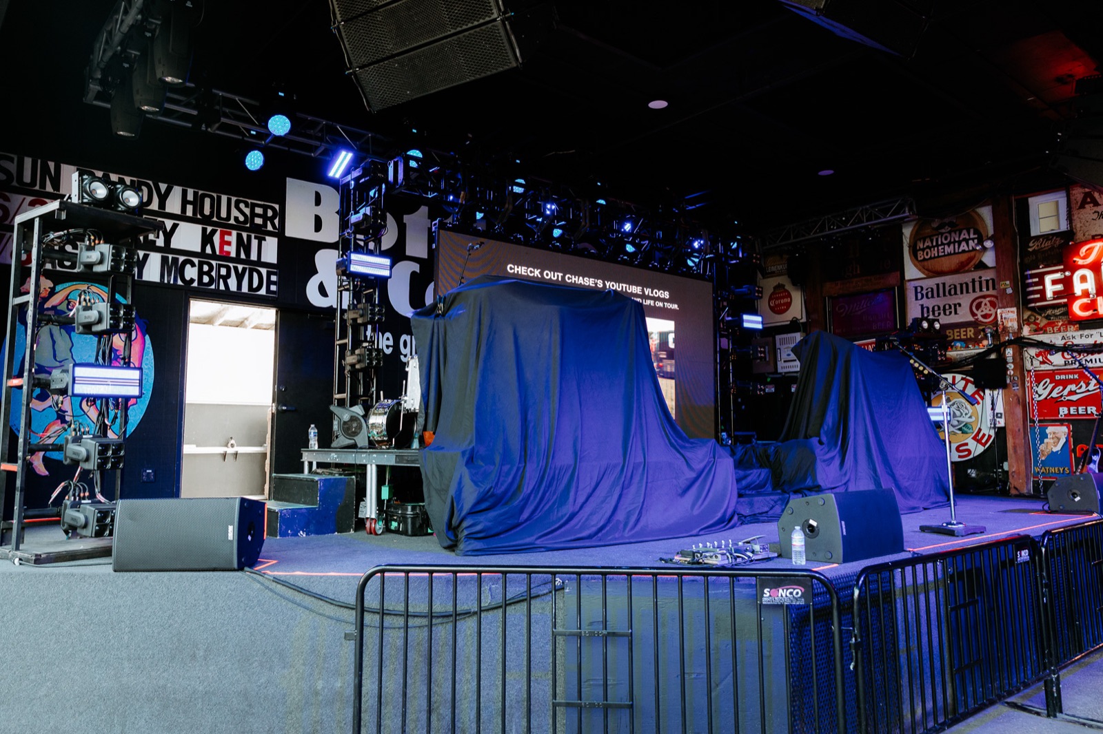 Stage set and covered behind the barricade, waiting for doors