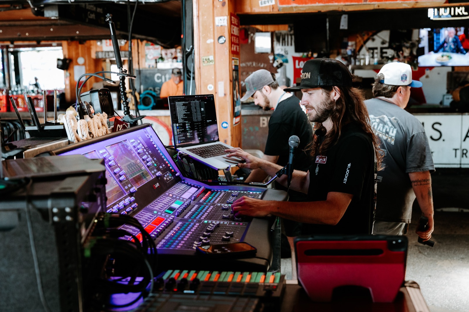 Crew at the lighting console as the room comes up