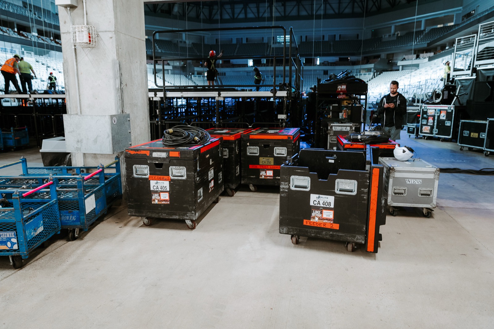 Flight cases staged on the arena floor