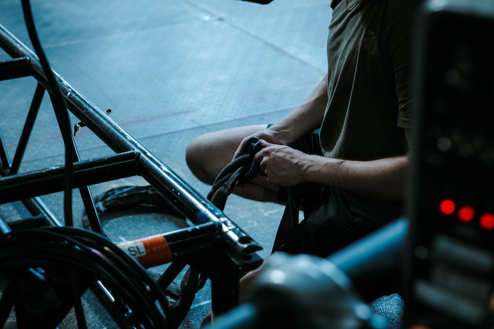 Crew member working on rigging hardware